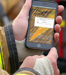 Hand holding a phone running an LR-x model